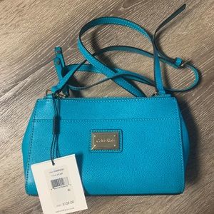 NWT Calvin Klein purse with gold detail. Color: surf